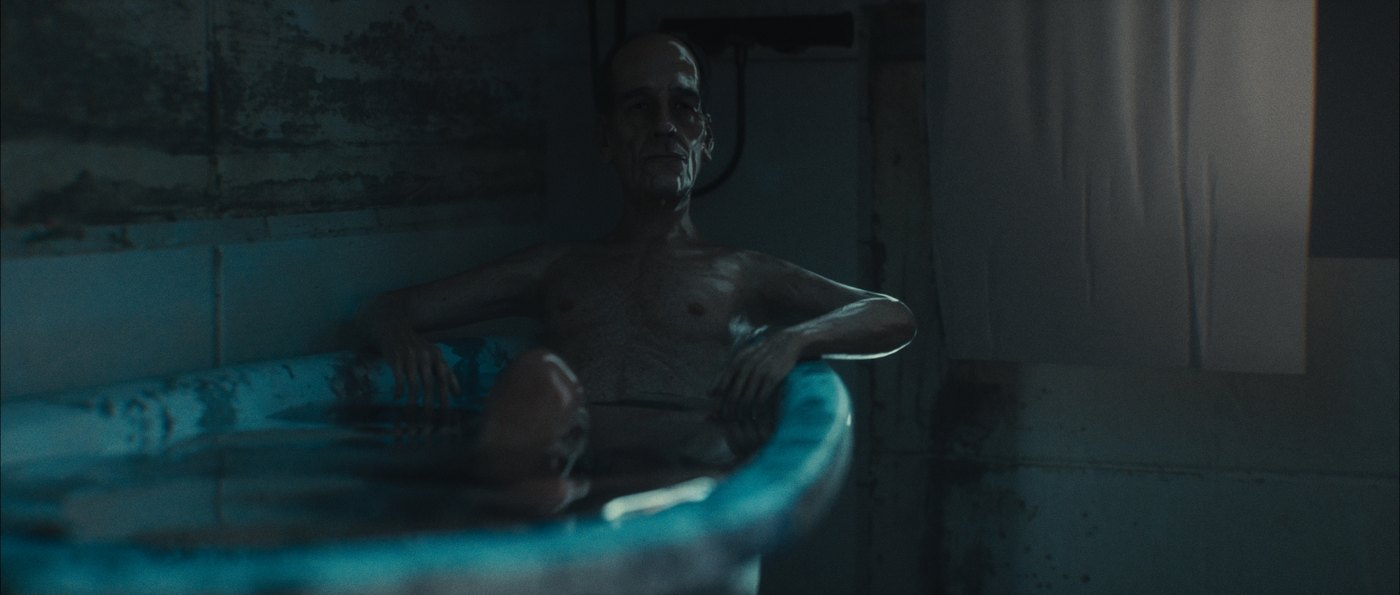 Forest Bathing — still: a man in a tub under cold light